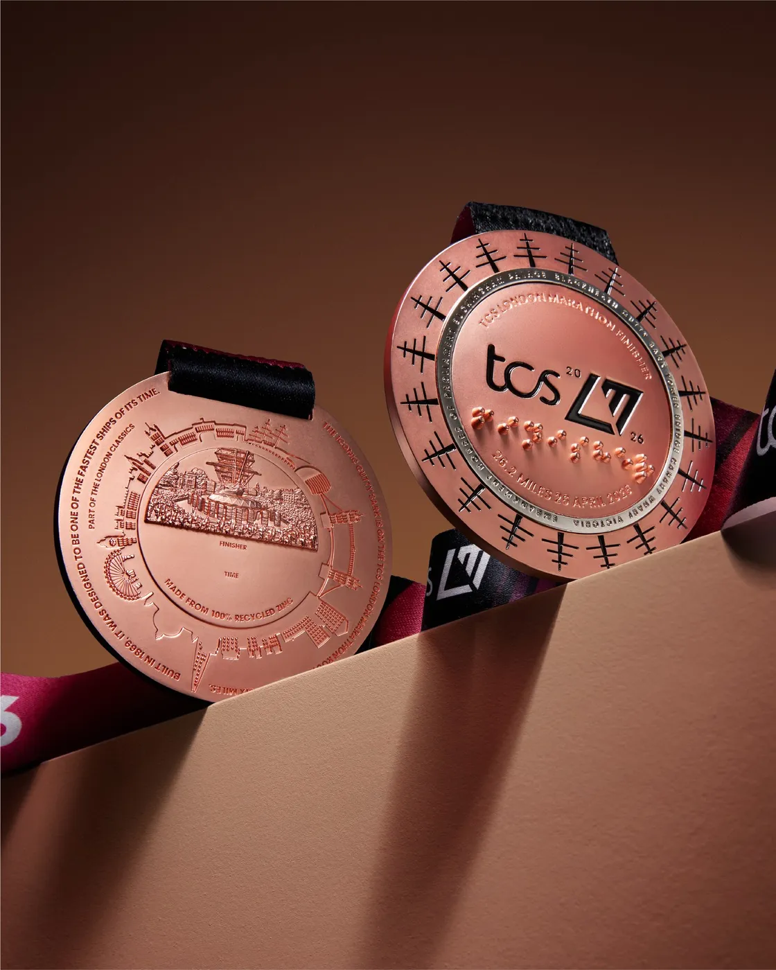 Two London Marathon 2026 medals: one showing the Cutty Sark, the other the back with “FINISHER”, braille and “26.2 miles, 26 April 2026”.
