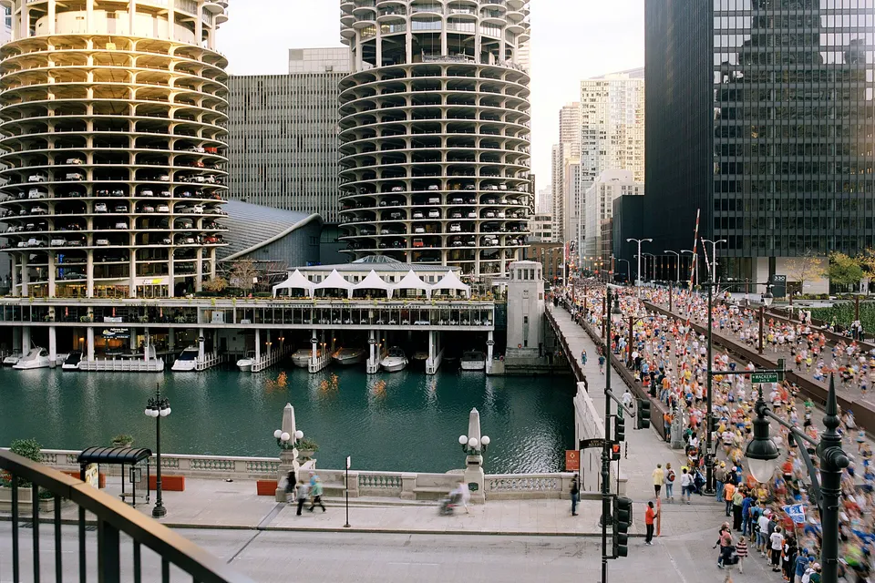 Runners cross the Chicago River beside the Marina City towers at the 2010 Chicago Marathon.